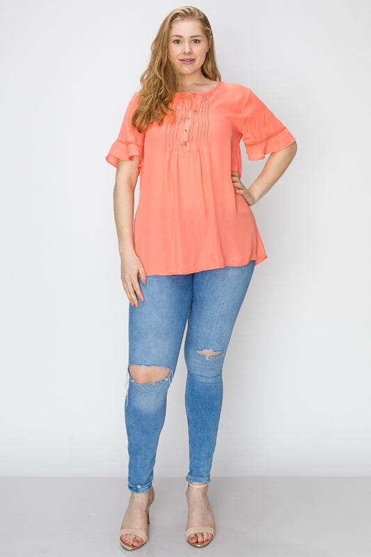 Short sleeve pintuck tunic blouse in hi-low design, plus size fit